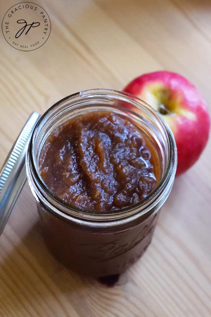 A side view looking down into a canning jar filled with this Amish Apple Butter Recipe.