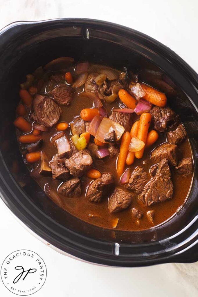 An overhead view looking down into a slow cooker filled with this Bison Stew Recipe.