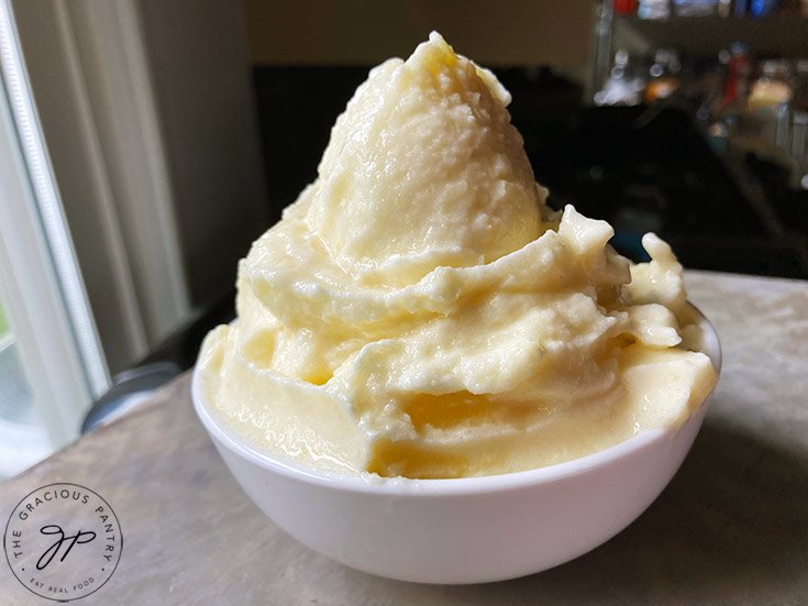 The finished Pineapple Whip Recipe served in a small, white bowl.