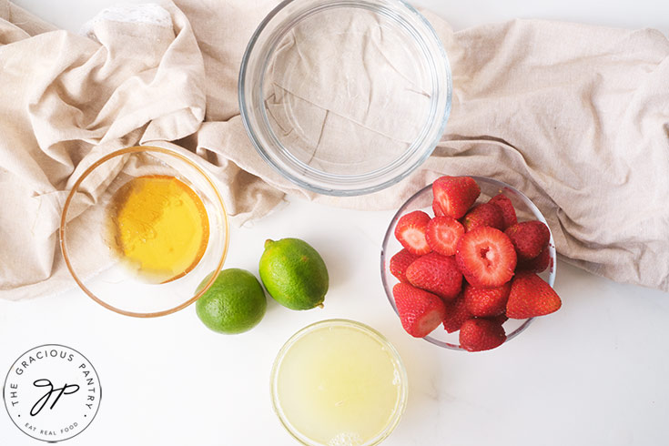 All the ingredients for this Strawberry Lemonade Recipe in individual bowls.