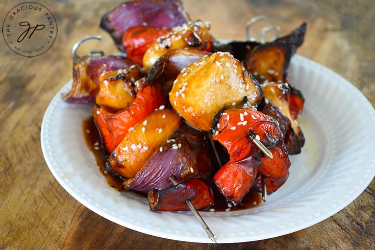 The finished Teriyaki Chicken Kabobs on a white plate.