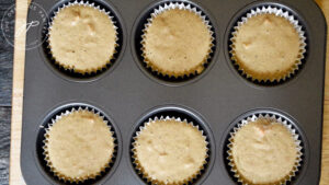 The raw batter sitting in the muffin pan.