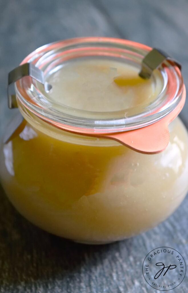 A close up view of this coconut caramel sauce in a small canning jar with the lid firmly attached.