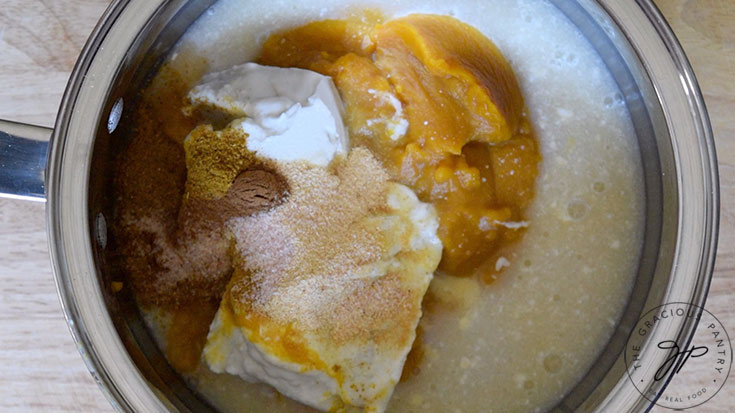 All the ingredients for this Curried Pumpkin Soup Recipe in a pot.