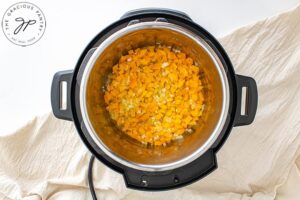 The onions and diced pepper sautéing in the Instant Pot.