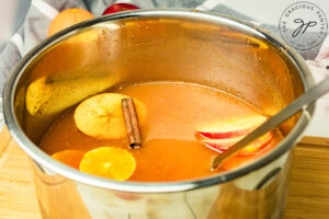 The fruit slices added to the pot.