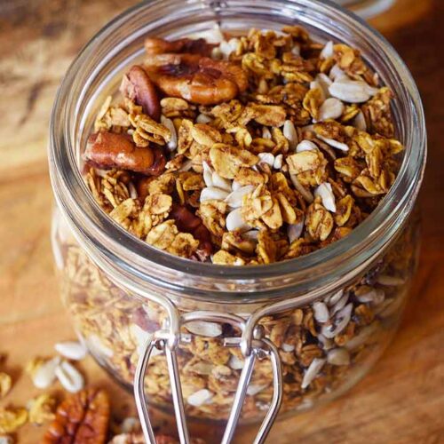 Pumpkin Granola in a canning jar with the lid open.