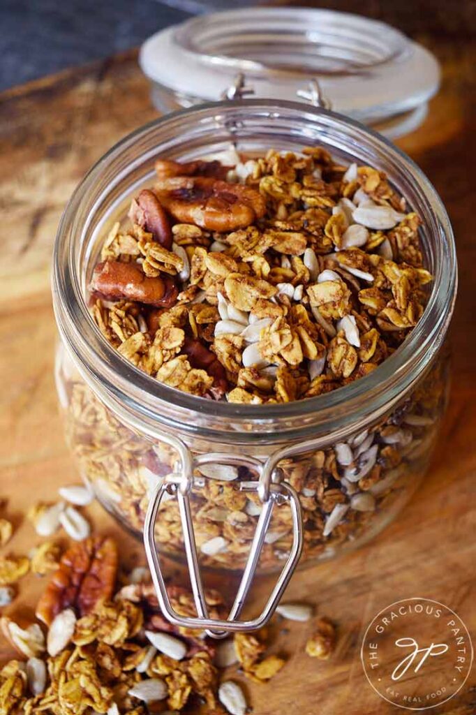 Pumpkin Granola in a canning jar with the lid open.