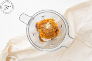 All the ingredients for this Pumpkin Oatmeal Pancakes Recipe sitting in a blender.