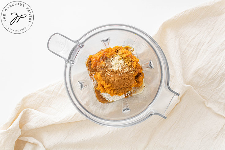 All the ingredients for this Pumpkin Oatmeal Pancakes Recipe sitting in a blender.