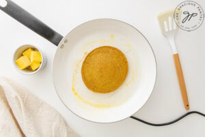 A finished Pumpkin Oatmeal Pancake still sitting in the pan it was cooked in.