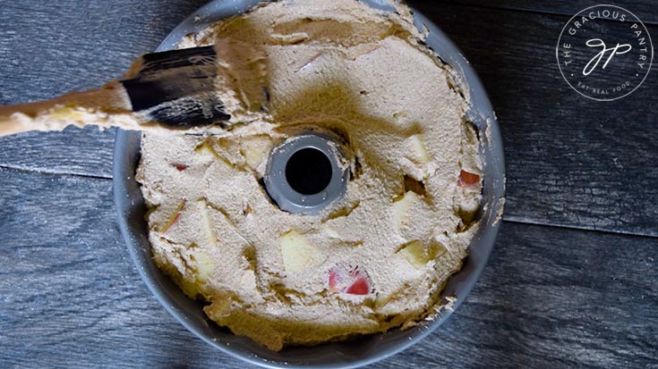 Smoothing the batter in the bundt pan.