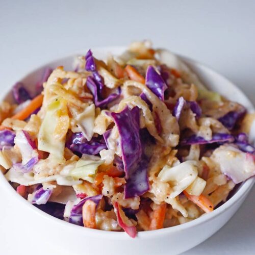 A front view of this Apple Slaw Recipe in a small, white bowl.