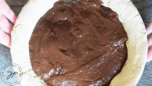 The pie crust filled with Easy Homemade Chocolate Pie filling.