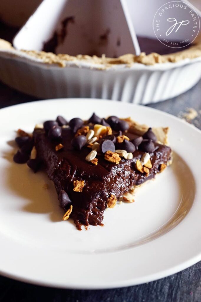 A single slice of thisEasy Homemade Chocolate Pie on a white plate.