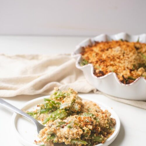 A single, white plate with a serving of Healthy Green Bean Casserole.