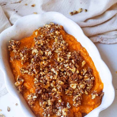 The finished Healthy Sweet Potato Casserole in a white casserole dish.