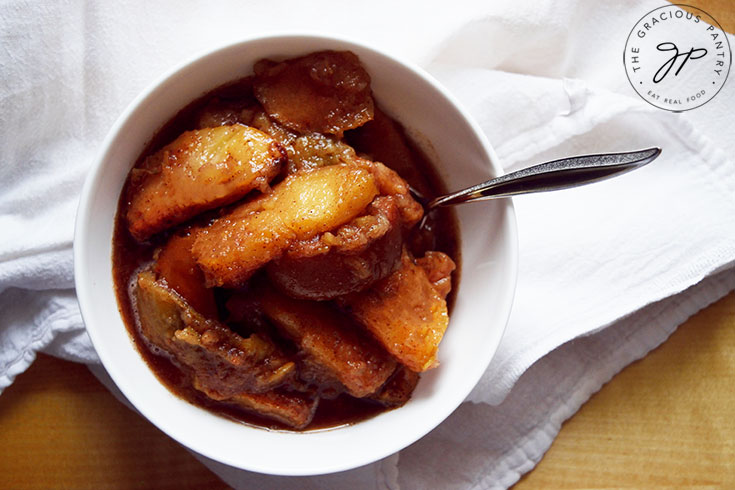 The finished Crockpot Cinnamon Apples, served in a white bowl.