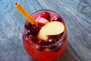 The finished Non Alcoholic Sangria Recipe, served in a stemless wine glass.