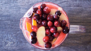 A pitcher of Non Alcoholic Sangria with fruit piled into the pitcher.