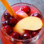 An overhead view looking down into a wine glass filled with Non Alcoholic Sangria.