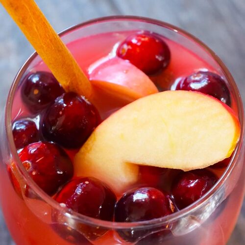 An overhead view looking down into a wine glass filled with Non Alcoholic Sangria.