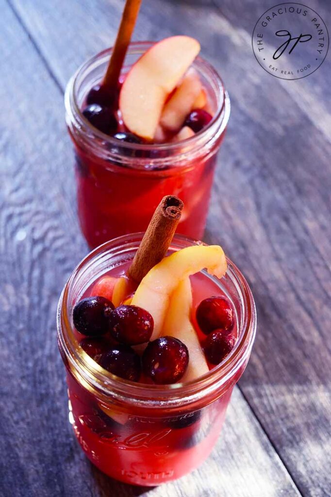 Overhead view of two small canning jars filled with Non Alcoholic Sangria.