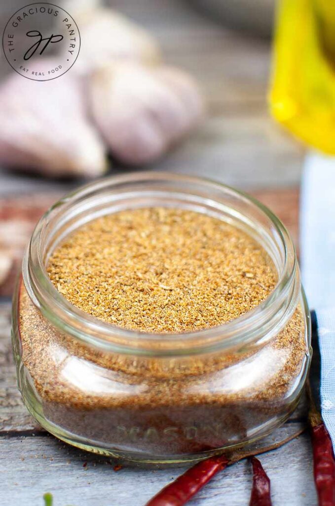 A side view of a jar filled with Homemade Fajita Seasoning.