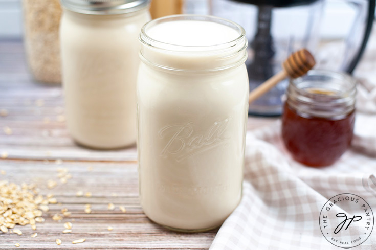 The finished oat milk in canning jars.