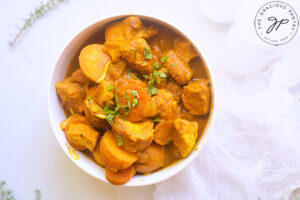 The finished Jamaican Curry Chicken Recipe, served in a white bowl.