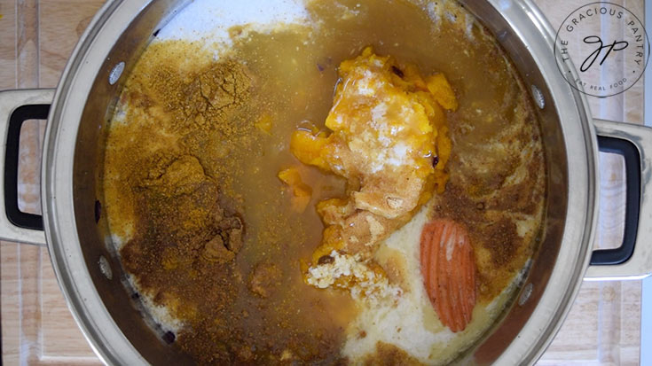 All the Kabocha Squash Soup Recipe ingredients sitting in a large soup pot.