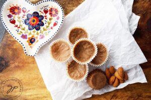 The finished Almond Butter Fat Bombs collected on a piece of parchment paper.