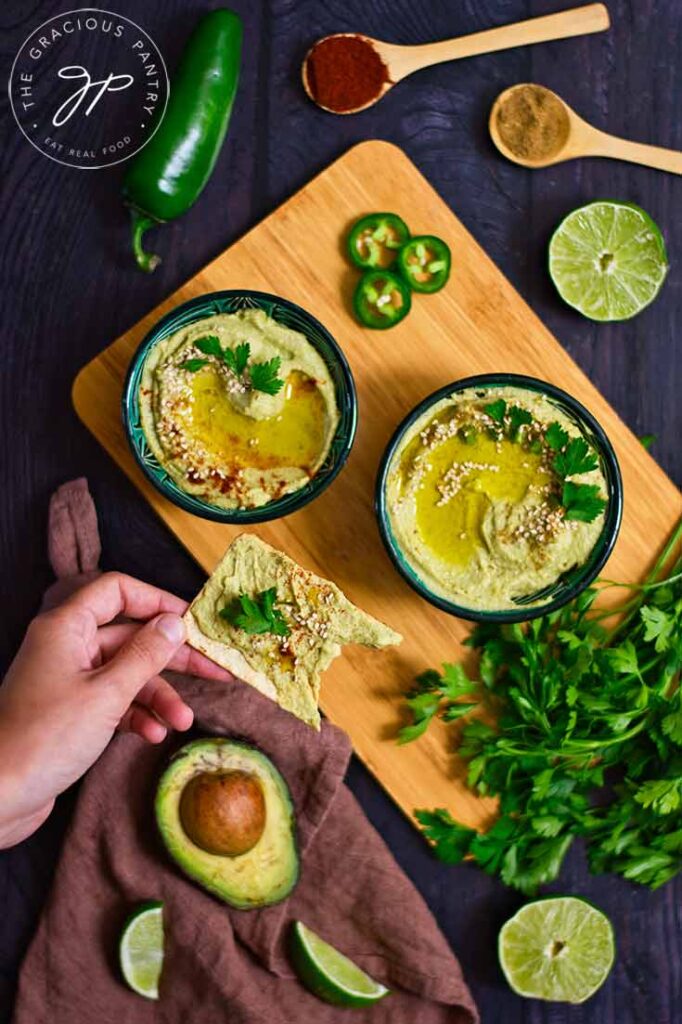 A cracker spread with Avocado Hummus.