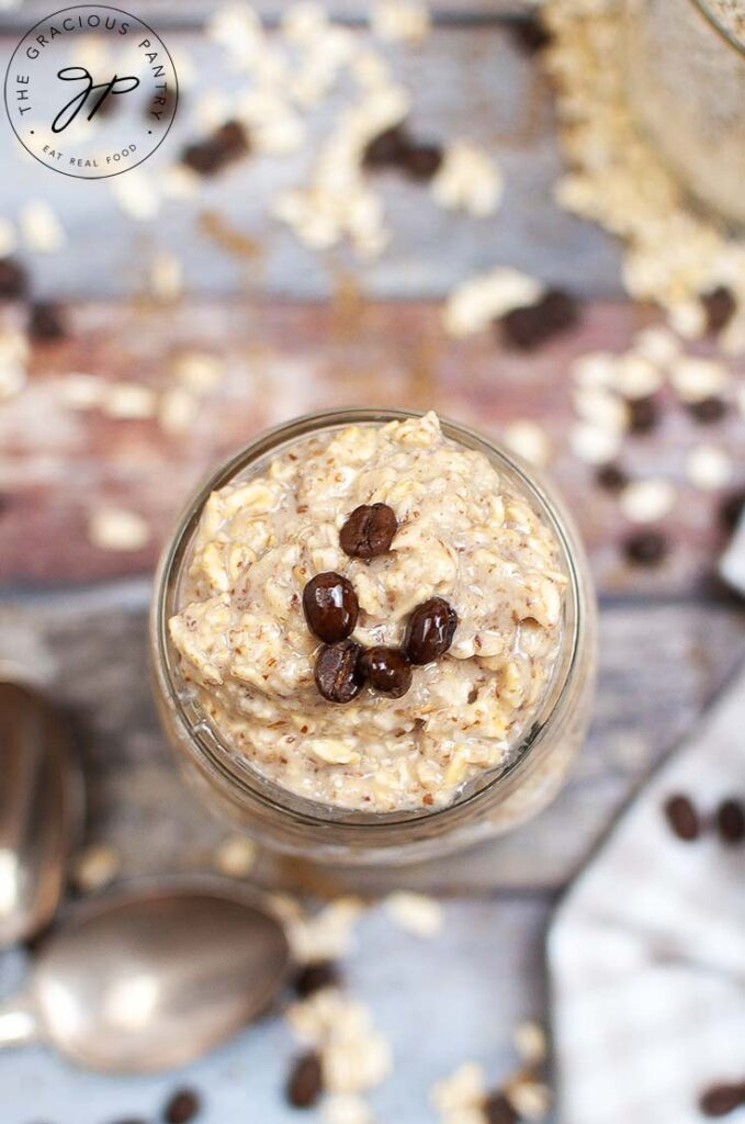 An overhead shot looking down into a canning jar filled with this Coffee Overnight Oats Recipe.