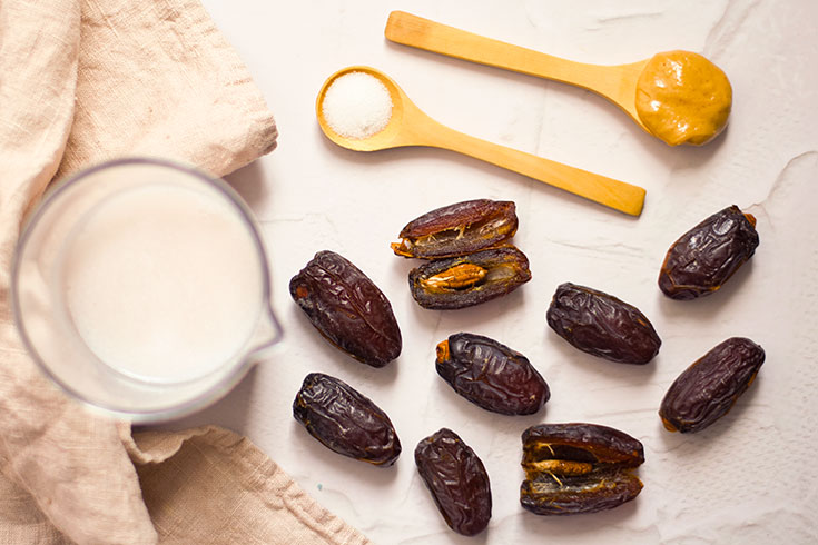 All the ingredients for this Date Caramel Recipe gathered on a white table.