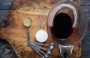 All the Grenadine Syrup Recipe ingredients sitting on a cutting board.