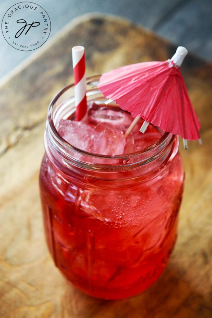 A shriley temple drink in a canning jar made with all natural Grenadine Syrup.