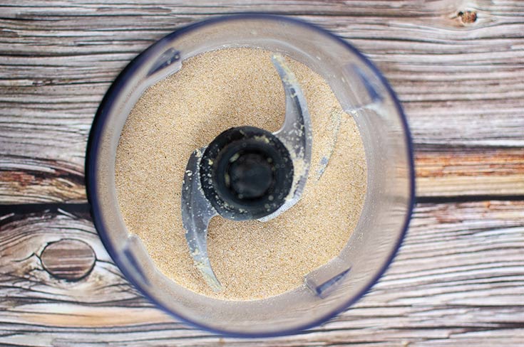 Ground onion powder sitting in a food processor.