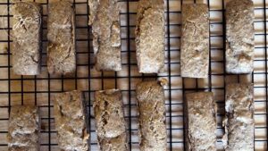 Low Carb Snack Bars lines up and cooling on a wire rack.