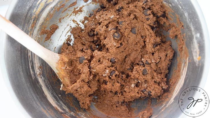 Just mixed dough in a stainless steel mixing bowl.