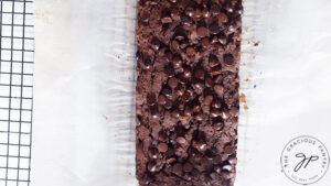 Just baked Chocolate Pumpkin Bread cooling on a black wire cooling rack.