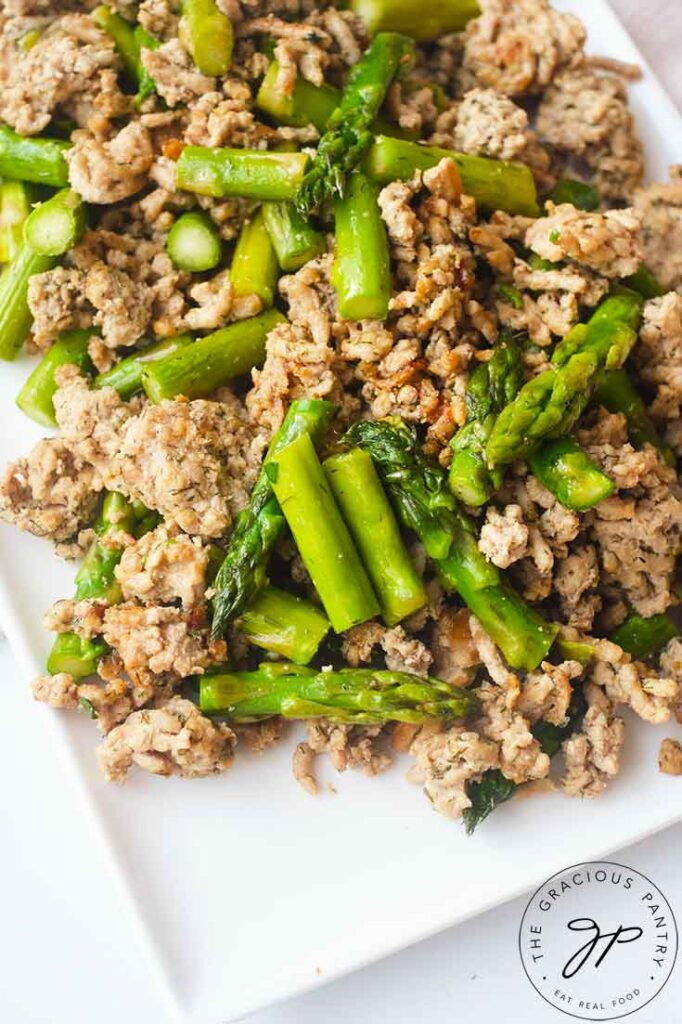 An up close, overhead view of a white platter holding a serving of this Ground Turkey Dinner Skillet Recipe.