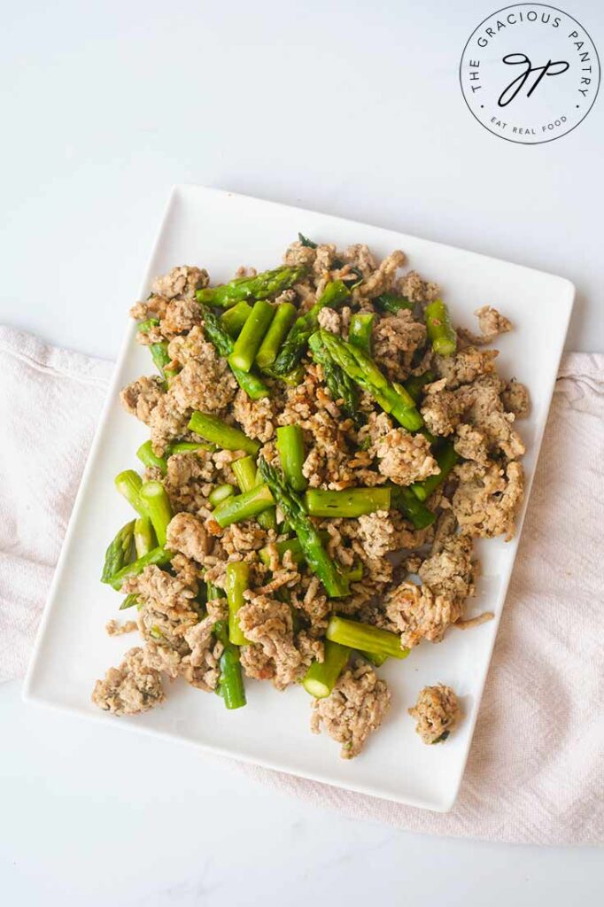 An overhead view of a square, white platter holding a swerving of this Ground Turkey Dinner Skillet Recipe.