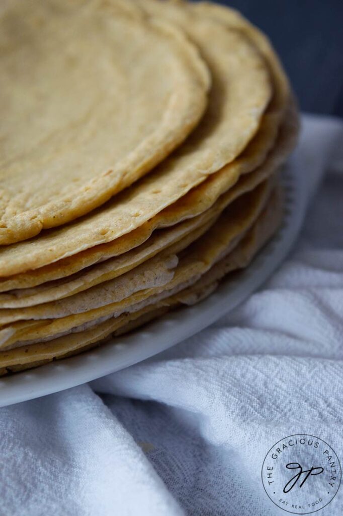 A side view of a stack of oat flour crepes.