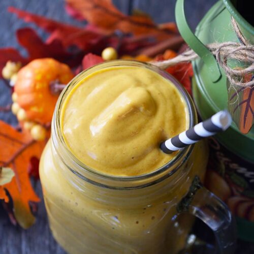 An overhead view looking down into a glass mug filled with this Pumpkin Pie Smoothie Recipe.