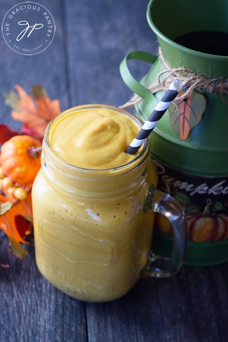 A side view of a glass mug filled with a Pumpkin Pie Smoothie.