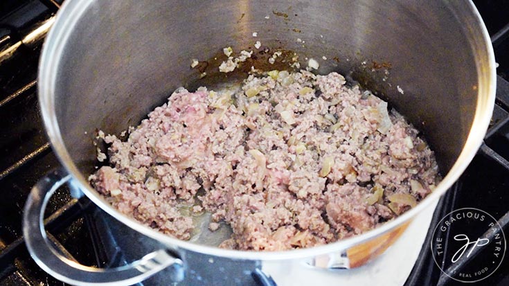 Browned ground turkey meat in a large stock pot.