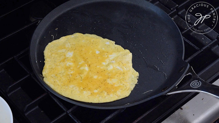 Cooked egg pancake on a skillet.