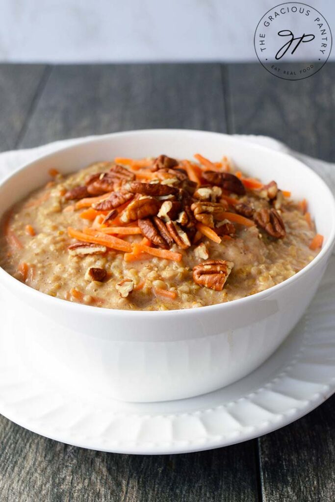 A front view of a white bowl filled with Carrot Cake Oatmeal.