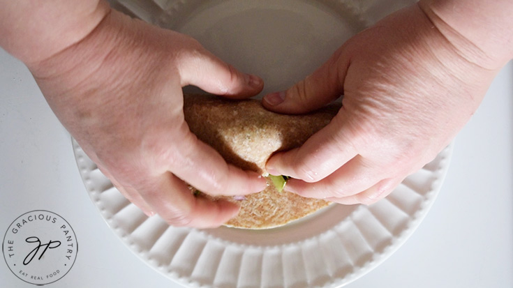 Rolling up a Cobb Salad Wrap.